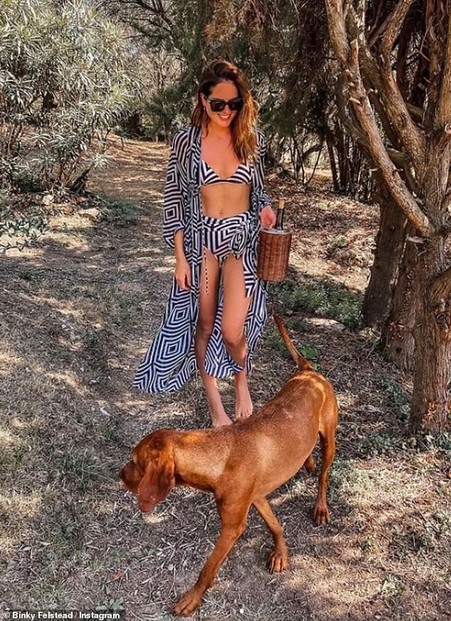 Stunning: Binky Felstead showed off her incredible physique in a black and white patterned bikini as she continued her honeymoon in the south of France on Thursday